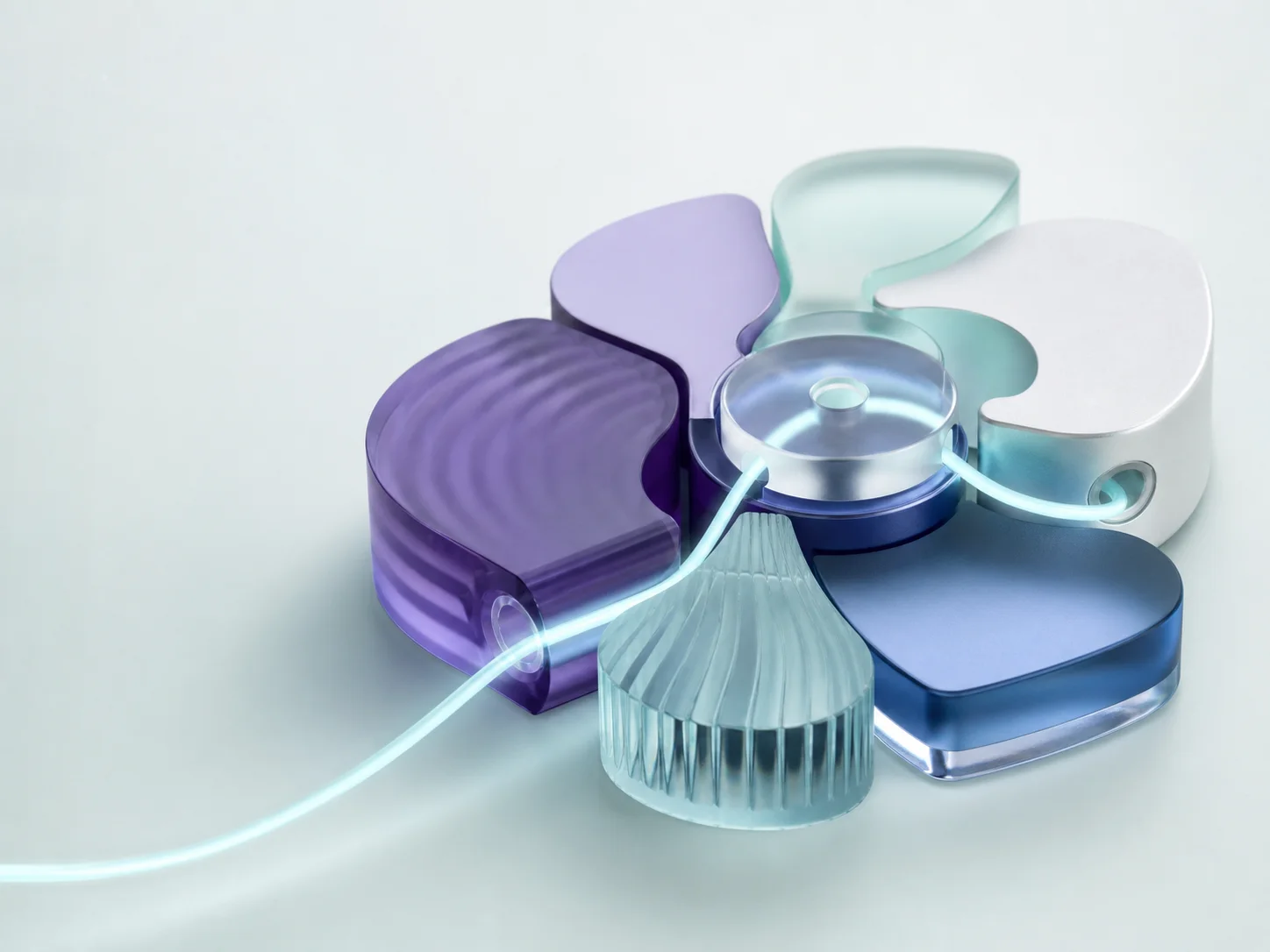 Interlocking violet, blue, and mint components connected by a luminous thread